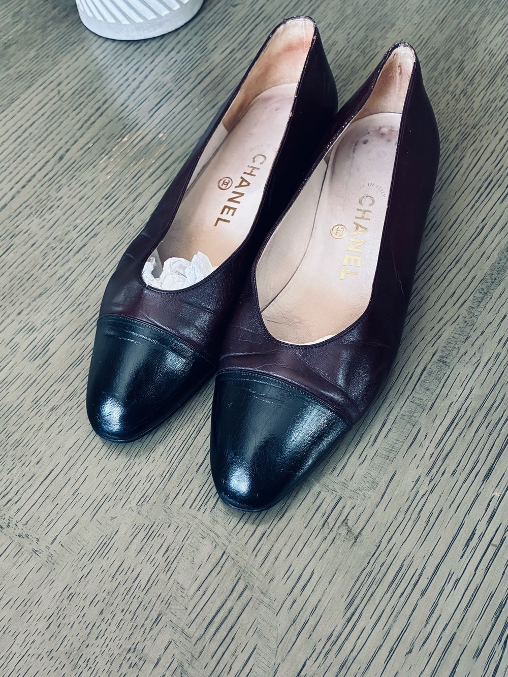 CHANEL Two-Tone Cap-Toe Flats in Black and Dark Brown